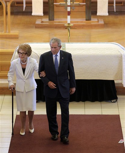 
 Former first lady Nancy Reagan, left, is escorted by former President George W. Bush following the funeral for former first lady Betty Ford at St. Margaret's Episcopal Church Tuesday, July 12, 2011, in Palm Desert, Calif. (AP Photo/Jae C. Hong, Pool)
 