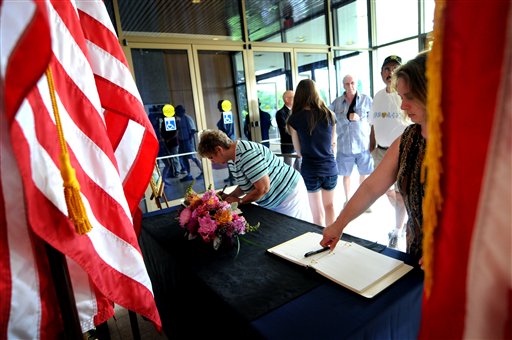 
 People sign the Betty Ford condolence book that is set up in the front lobby of the Gerald R. Ford Presidential Museum in Grand Rapids, Mich., Sunday, July 10, 2011. The former first lady died Friday at the age of 93. (AP Photo/The Grand Rapids Press, Katy Batdorff)
 