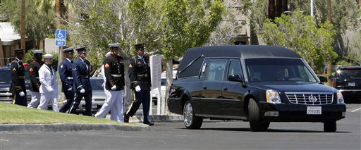 
 A military honor guard follows the hearse carrying former first lady Betty Ford to her funeral at St. Margaret's Episcopal Church in Palm Desert, Calif., Tuesday, July 12, 2011. (AP Photo/Reed Saxon, Pool)
 