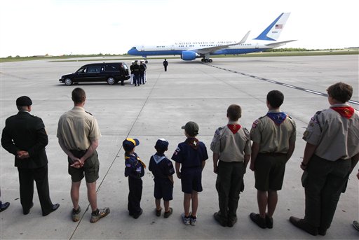 
 Military officers and scouts watch a plane arrive with the casket of former first lady Betty Ford arrives at Gerald R. Ford International Airport in Cascade Township, Mich., Wednesday, July, 13, 2011. Ford will be buried in Grand Rapids, Mich., on Thursday next to her husband, former President Gerald R. Ford. (AP Photo/Paul Sancya)
 
