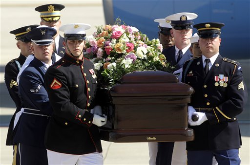 
 A military honor guard carries the casket of former first lady Betty Ford after arriving at Gerald R. Ford International Airport in Cascade Township, Mich., Wednesday, July, 13, 2011. Ford will be buried in Grand Rapids, Mich., on Thursday next to her husband, former President Gerald R. Ford. (AP Photo/Paul Sancya)
 
