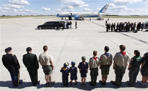 
 Family, scouts and military watch as an military honor guard carries the casket of former first lady Betty Ford after arriving at Gerald R. Ford International Airport in Cascade Township, Mich., Wednesday, July, 13, 2011. Ford will be buried in Grand Rapids, Mich., on Thursday next to her husband, former President Gerald R. Ford. (AP Photo/Paul Sancya)
 