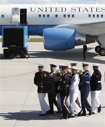 
 A military honor guard carries the casket of former first lady Betty Ford after arriving at Gerald R. Ford International Airport in Cascade Township, Mich., Wednesday, July, 13, 2011. Ford will be buried in Grand Rapids, Mich., on Thursday next to her husband, former President Gerald R. Ford. (AP Photo/Paul Sancya)
 