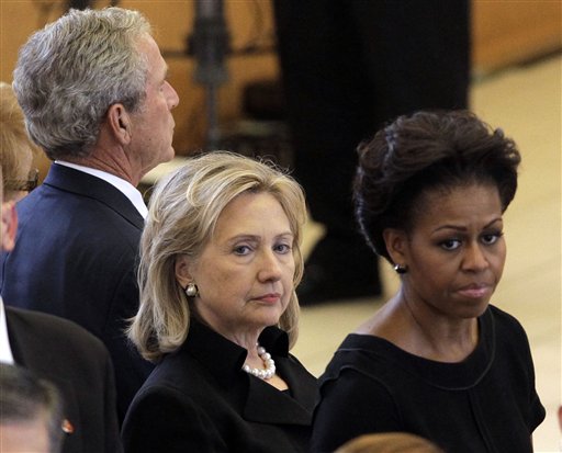 
 Secretary of State Hillary Rodham Clinton, center, and first lady Michelle Obama stand together during the funeral for former first lady Betty Ford at St. Margaret's Episcopal Church Tuesday, July 12, 2011, in Palm Desert, Calif. Former President George W. Bush is at back. (AP Photo/Jae C. Hong, Pool)
 
