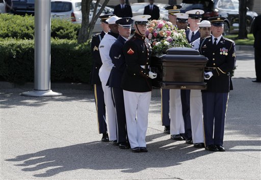 
 A military honor guard carries the casket bearing the body of former first lady Betty Ford as it arrives at Gerald R. Ford Presidential Museum Wednesday, July 13, 2011, in Grand Rapids, Mich. The former first lady will be buried at the museum on Thursday next to her husband, former President Gerald R. Ford. (AP Photo/M. Spencer Green)
 
