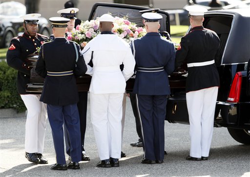 
 A military honor guard carries the casket bearing the body of former first lady Betty Ford as it arrives at Gerald R. Ford Presidential Museum Wednesday, July 13, 2011 in Grand Rapids, Mich. Former first lady will be buried at the museum on Thursday next to her husband former President Gerald R. Ford. (AP Photo/M. Spencer Green)
 
