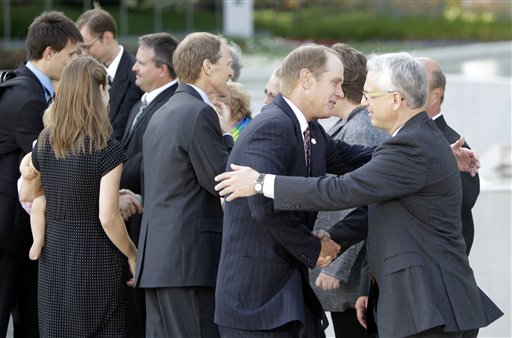 
 Steve Ford, second from right, and members of the Ford family greets museum staff after the private visitation of former first lady Betty Ford at Gerald R. Ford Presidential Museum Wednesday, July 13, 2011 in Grand Rapids, Mich. The former first lady will be buried at the museum on Thursday next to her husband former President Gerald R. Ford. (AP Photo/Carlos Osorio)
 
