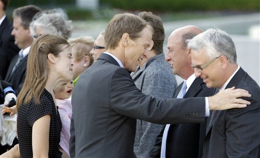 
 Mike Ford and members of the Ford family thank museum staff after the private visitation for former first lady Betty Ford at Gerald R. Ford Presidential Museum Wednesday, July 13, 2011 in Grand Rapids, Mich. The former first lady will be buried at the museum on Thursday next to her husband former President Gerald R. Ford.(AP Photo/Carlos Osorio)
 