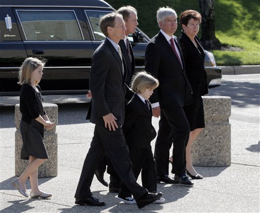 
 Michigan Gov. Rick Snyder, and his wife Sue Snyder, right, Steve Ford, second from left, Michael Ford, third from left, and other family members follow as the casket bearing the body of former first lady Betty Ford arrives at Gerald R. Ford Presidential Museum Wednesday, July 13, 2011 in Grand Rapids, Mich. The former first lady will be buried at the museum on Thursday next to her husband former President Gerald R. Ford.The Ford family follows as the casket bearing the body of former first lady Betty Ford arrives at Gerald R. Ford Presidential Museum Wednesday, July 13, 2011 in Grand Rapids, Mich. The former first lady will be buried at the museum on Thursday next to her husband former President Gerald R. Ford. (AP Photo/M. Spencer Green)
 