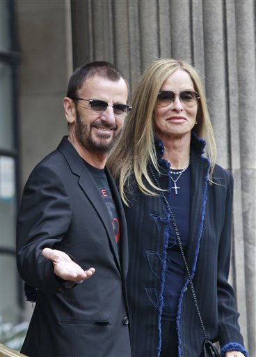 
 Former Beatle Ringo Starr and his wife Barbara Bach arrive to attend the civil ceremony marriage of American heiress Nancy Shevell and Paul McCartney at Marylebone Town Hall, in central London, Sunday Oct. 9, 2011. (AP Photo/Lefteris Pitarakis)
 