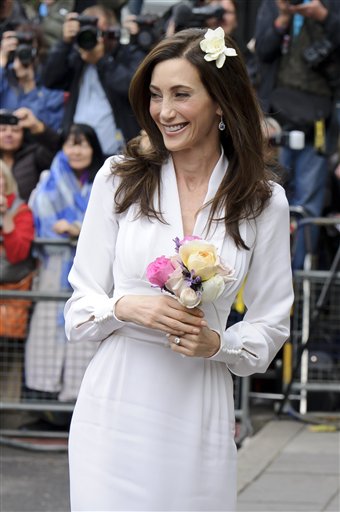 
 American heiress Nancy Shevell is seen as she leaves Marylebone Town Hall, London, after her wedding to former Beatle Paul McCartney Sunday, Oct. 9, 2011. McCartney and Shevell were married on Sunday, emerging joyously from a 45-minute civil marriage ceremony to be showered with confetti from fans. (AP Photo/Jonathan Short)
 