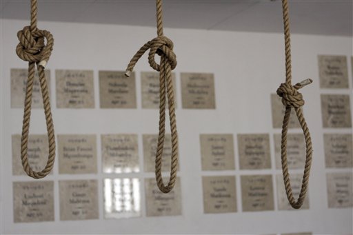
 In this photo taken Thursday, Dec 8. 2011, nooses hang in the gallows at the Pretoria Central Prison. The government opened the gallows, in Pretoria, South Africa, Thursday, Dec. 15, as a monument to those who were executed before being stopped in 1989 and abolished in 1995. In background are plaques to those political prisoners who were executed. (AP Photo/Denis Farrell)
 