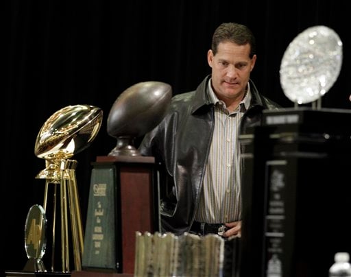 
 Auburn head coach Gene Chizik arrives at a news conference after the BCS National Championship NCAA college football game Tuesday, Jan. 11, 2011, in Scottsdale, Ariz. Auburn beat Oregon 22-19 to capture the championship. (AP Photo/Charlie Riedel)
 