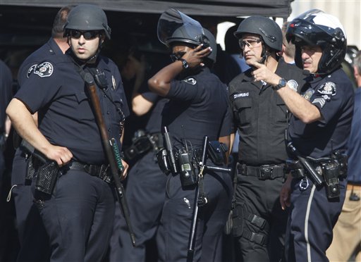 
 Law enforcement officers stand outside Gardena High School on Jan.18, 2011 in Gardena, Calif, after reports of a number of students being wounded during a shooting. (AP Photo/Damian Dovarganes)
 