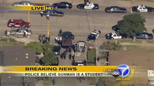 
 This frame grab from video made available by ABC7.com, shows police and emergency personnel at Gardena High School in Gardena, Calif. According to officials, a number of students were wounded in a shooting at the high school. (AP Photo/ABC7.com) NO SALES
 