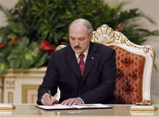 
 Belarusian President Alexander Lukashenko signs an act of taking an oath during his inauguration ceremony at the Palace of the Republic in Minsk, Belarus, Friday, Jan. 21, 2011. Alexander Lukashenko was sworn in Friday for a fourth term. (AP Photo/Sergei Grits, Pool)
 