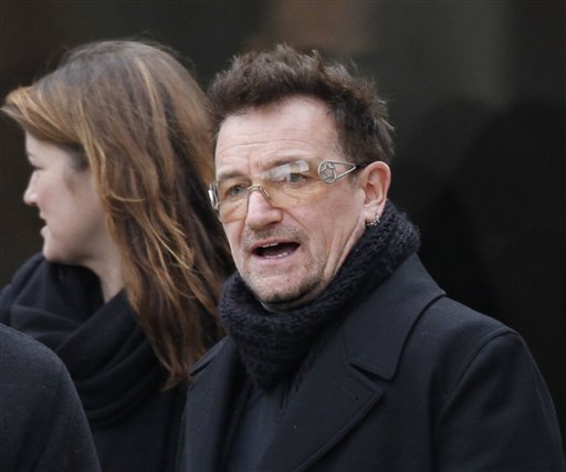 
 Rock singer Bono leaves following the funeral Mass for R. Sargent Shriver at Our Lady of Mercy Catholic church in Potomac, Md., just outside Washington, Saturday, Jan. 22, 2011. Shriver, the man responsible for launching the Peace Corps after marrying into the Kennedy family, died last Tuesday at age 95 after suffering from Alzheimer's disease for years. (AP Photo/J. Scott Applewhite)
 