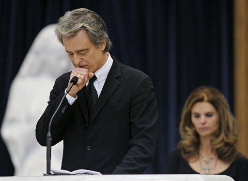 
 Robert 'Bobby' Shriver III pauses while speaking about his father, R. Sargent Shriver, at his father's funeral Mass at Our Lady of Mercy Catholic church in Potomac, Md., just outside Washington Saturday, Jan. 22, 2011. Shriver, an in-law of the Kennedys, and the first director of the Peace Corps, died Tuesday. He was 95. At right is Bobby's sister, Maria Shriver. (AP Photo/Cliff Owen, Pool)
 