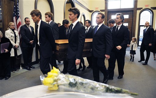 
 The casket containing the remains of R. Sargent Shriver is carried through the lobby of Our Lady of Mercy chuch in Potomac, Md., during a funeral Mass Saturday, Jan. 22, 2011. Shriver, an in-law of the Kennedys, and the first director of the Peace Corps, died Tuesday. He was 95. (AP Photo/Cliff Owen, Pool)
 