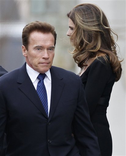 
 Maria Shriver, right, and her husband, actor and former California Governor Arnold Schwarzenegger, stand amid family members and other mourners as they leave the funeral Mass for her father, R. Sargent Shriver, at Our Lady of Mercy Catholic church in Potomac, Md., just outside Washington, Saturday, Jan. 22, 2011. Shriver, the man responsible for launching the Peace Corps after marrying into the Kennedy family, died last Tuesday at age 95 after suffering from Alzheimer's disease for years. (AP Photo/J. Scott Applewhite)
 