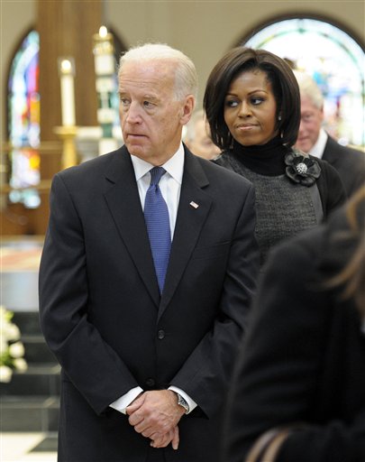 
 Vice President Joe Biden, left, first lady Michelle Obama and former President Bill Clinton, right, attend the funeral Mass for R. Sargent Shriver at Our Lady of Mercy Catholic church in Potomac, Md., Saturday, Jan. 22, 2011. Shriver, an in-law of the Kennedys, and the first director of the Peace Corps, died Tuesday. He was 95.(AP Photo/Cliff Owen/Pool)
 
