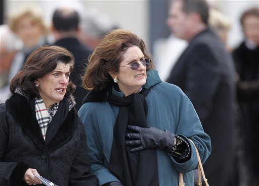 
 Lynda Johnson Robb, center, daughter of former President Lyndon Johnson, leaves following the funeral Mass for R. Sargent Shriver at Our Lady of Mercy Catholic church in Potomac, Md., just outside Washington, Saturday Jan. 22, 2011. Shriver, the man responsible for launching the Peace Corps after marrying into the Kennedy family, died last Tuesday at age 95 after suffering from Alzheimer's disease for years. (AP Photo/J. Scott Applewhite)
 