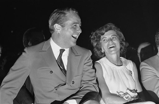 
 FILE - In this April 24, 1968, file photo Sargent Shriver and his wife Eunice watch a satirical presentation on a day in the life of Shriver by the staff of the Office of Economic Opportunity, during a farewell party for the former director of the poverty program, designated to become ambassador to France. Shriver died Tuesday Jan. 18, at the age of 95. His funeral was held in Potomac, Md., Saturday, Jan. 22, 2011. (AP Photo/Charles Harrity, File)
 