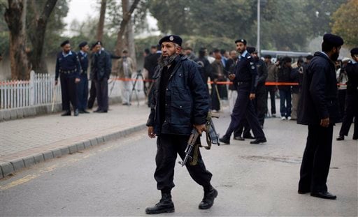 
 Pakistani police officers gather at the site where Punjab Gov. Salman Taseer was shot dead by one of his guards, in Islamabad, Pakistan, Tuesday, Jan. 4, 2011. The governor of Pakistan's powerful Punjab province was shot dead Tuesday by one of his guards in the Pakistani capital, police said, the killing was the most high-profile assassination of a political figure in Pakistan since the slaying of former Prime Minister Benazir Bhutto in December of 2007. (AP Photo/Muhammed Muheisen)
 