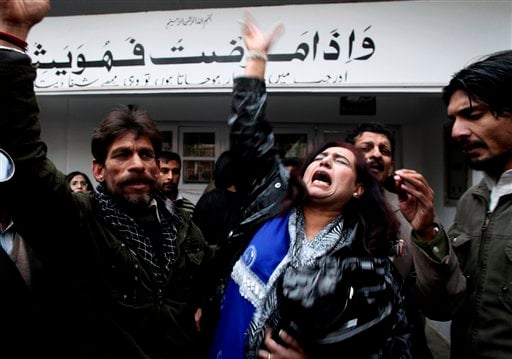 
 Supporters of Pakistan People's party mourn the death of Punjab's governor Salman Taseer who was shot dead by one of his guards, at a local hospital in Islamabad, Pakistan, on Tuesday, Jan. 4, 2011. The governor of Pakistan's powerful Punjab province was assassinated Tuesday by one of his guards. (AP Photo/B.K.Bangash)
 