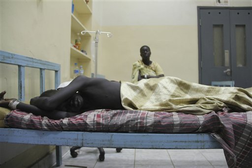 
 Changkouth Sinchot, a young boy lies of a bed, in Juba Teaching Hospital after he suffered a bullet wound to his left leg during the February 9-10 attacks on the town of Fangak when southern rebel leader George Athor and his men attacked the town and fought with southern security forces. Southern leaders say more than 200 were killed. . (AP Photo/Maggie Fick).
 