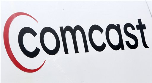
 This Comcast logo is displayed on an installation truck in Pittsburgh, Tuesday, Feb. 15, 2011. Comcast Corp., a leading cable, entertainment and communications company, announced Wednesday, Feb. 16, that the company's planned annual dividend has increased 19% to $0.45 per share. (AP Photo/Gene J. Puskar)
 