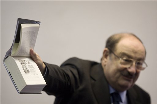 
 Italian writer Umberto Eco holds up his novel 'The Cemetery of Prague' during a press conference at the 25th Annual Book Fair in Jerusalem, Wednesday, Feb. 23, 2011. Celebrated Italian writer Umberto Eco said Wednesday boycotting scholars for their governments' policies is 'a form of racism' and 'absolutely crazy.' But he says he faced no pressure from colleagues to boycott a book fair in Jerusalem to protest Israel's treatment of the Palestinians. (AP Photo/Sebastian Scheiner)
 