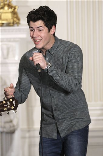 
 Singer Nick Jonas performs in the State Dining Room of the White House in Washington, Thursday, Feb. 24, 2011, during a music discussion for students hosted by Michelle Obama highlighting Motown artists. (AP Photo/Charles Dharapak)
 