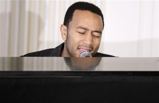 
 Singer John Legend performs in the State Dining Room of the White House in Washington, Thursday, Feb. 24, 2011, during a discussion hosted by First lady Michelle Obama for students highlighting, Motown artists. (AP Photo/Charles Dharapak)
 
