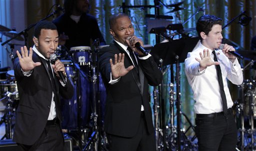 
 From left, singers John Legend, Jamie Foxx, and Nick Jonas, perform on stage during the White House Music Series saluting Motown in the East Room of the White House in Washington, Thursday, Feb. 24, 2011. (AP Photo/Pablo Martinez Monsivais)
 