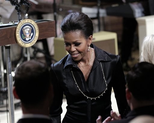 
 First lady Michelle Obama arrives for the White House Music Series saluting Motown in the East Room of the White House in Washington, Thursday, Feb. 24, 2011. (AP Photo/Pablo Martinez Monsivais)
 