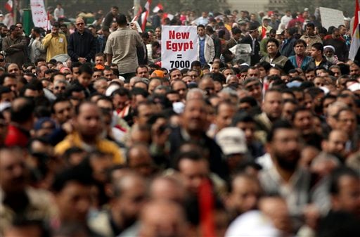 
 Egyptian protesters attend Friday prayers in Tahrir Square, Cairo, Egypt, Friday, Feb. 25, 2011. Tens of thousands rallied in Cairo's Tahrir Square on Friday, trying to keep up pressure on Egypt's military rulers to carry out reforms and calling for the dismissal of holdovers from the regime of ousted President Hosni Mubarak. (AP Photo/Khalil Hamra)
 