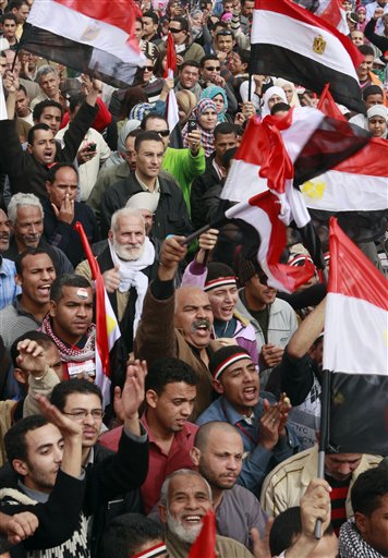 
 Egyptians wave by their flags at Tahrir Square, the focal point of the Egyptian uprising, in Cairo, Egypt, Friday, Feb. 25, 2011. The deputy to Osama bin Laden issued al-Qaida's second message since the Egyptian uprising, accusing the nation's Christian leadership of inciting interfaith tensions and denying that the terror network was behind last month's bombing of a Coptic church in Alexandria that killed 21 and sparked protests. (AP Photo/Amr Nabil)
 