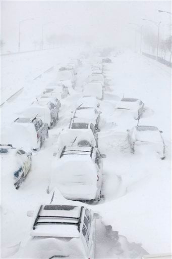 
 Hundreds of cars are seen stranded on Lake Shore Drive, Wednesday, Feb. 2, 2011 in Chicago. A winter blizzard of historic proportions wobbled an otherwise snow-tough Chicago, stranding hundreds of drivers for up to 12 hours overnight on the city's showcase lakeshore thoroughfare and giving many city schoolchildren their first ever snow day. (AP Photo/Kiichiro Sato)
 