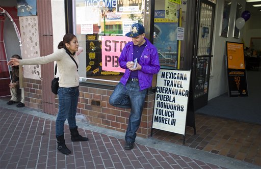 
 Ruby Acosta and Daniel Sandoval talk outside a travel shop in Santa Ana, Calif. on Tuesday, March 8, 2011. Surging Latino and Asian populations accounted for virtually all of California�s population growth over the last decade, new census data showed on Tuesday. In the decade spanning 2000 and 2010, Latinos grew by 28 percent to 14 million in the nation�s most populous state, while Asians grew even faster, by 31 percent, to reach 4.8 million. In contrast, non-Hispanic whites decreased by 5 percent and the state�s African-American population dipped by 1 percent. Over the decade, California�s population grew only 10 percent to 37.3 million, ranking just 20th nationally and lagging behind other western states such as Nevada and Arizona. (AP Photo/Orange County Register, Jebb Harris)
 