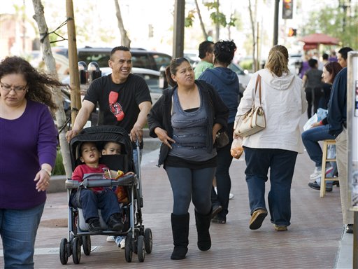 
 Families shop in downtown Santa Ana, Calif. on Tuesday, March 8, 2011. Surging Latino and Asian populations accounted for virtually all of California�s population growth over the last decade, new census data showed on Tuesday. In the decade spanning 2000 and 2010, Latinos grew by 28 percent to 14 million in the nation�s most populous state, while Asians grew even faster, by 31 percent, to reach 4.8 million. In contrast, non-Hispanic whites decreased by 5 percent and the state�s African-American population dipped by 1 percent. Over the decade, California�s population grew only 10 percent to 37.3 million, ranking just 20th nationally and lagging behind other western states such as Nevada and Arizona. (AP Photo/Orange County Register, Jebb Harris)
 