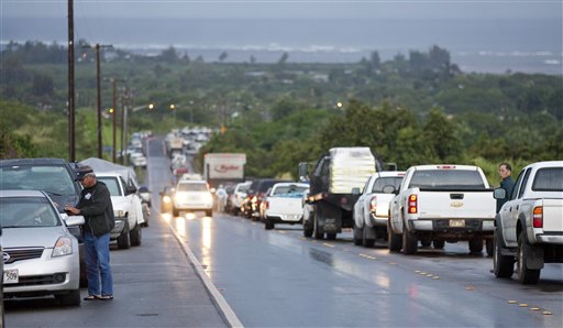 
 Due to a tsunami warning hundreds of cars line Kamehameha Highway leading into the town of Haleiwa as residents of the north shore community wait for the all clear to return home Friday, March 11, 2011 in Honolulu. An 8.9-magnitude earthquake struck Japan and sent a tsunami wave across the Pacific. (AP Photo/Eugene Tanner)
 