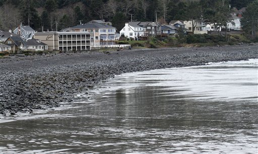 
 Bare beach is shown as the water recedes before a tsunami surge in Seaside, Ore., Friday, March, 11, 2011. The tsunami traveled across the Pacific Ocean after an 8.9-magnitude earthquake struck the east coast of Japan. (AP Photo/Don Ryan)
 