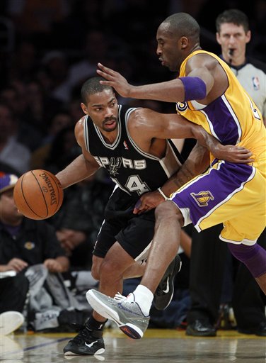 
 San Antonio Spurs' Gary Neal, left, drives around Los Angeles Lakers' Kobe Bryant during the first half of an NBA basketball game in Los Angeles, Tuesday, April 12, 2011. (AP Photo/Chris Carlson)
 