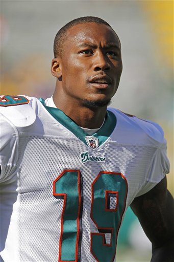 
 FILE - This Oct. 17, 2010, file photo shows Miami Dolphins wide receiver Brandon Marshall prior to an NFL football game against the Green Bay Packers, in Green Bay, Wis. Marshall's wife is accused of stabbing the Miami Dolphins wide receiver and has been arrested on a domestic violence charge, according to a police report. The report, which was posted on The South Florida Sun Sentinel's website, says Michi Nogami-Marshall stabbed her husband with a kitchen knife Friday, April 22, 2011.(AP Photo/Matt Ludtke, File)
 