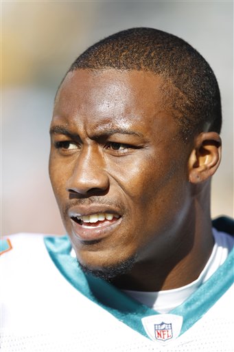
 FILE - This Oct. 17, 2010, file photo shows Miami Dolphins wide receiver Brandon Marshall before an NFL football game, in Green Bay, Wis. Marshall's wife is accused of stabbing the Miami Dolphins wide receiver and has been arrested on a domestic violence charge, according to a police report. The report, which was posted on The South Florida Sun Sentinel's website, says Michi Nogami-Marshall stabbed her husband with a kitchen knife Friday, April 22, 2011. (AP Photo/Mike Roemer, File)
 