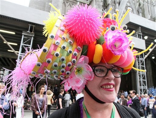 
 Wearing a hat made with plastic puppet eyes, Leslie Lowe, of New York, poses for photographs as she takes part in the Easter Parade along New York's Fifth Avenue Sunday, April 24, 2011. (AP Photo/Tina Fineberg)
 