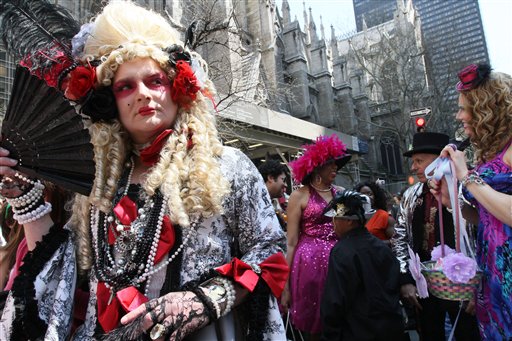
 Wearing a costume, Giovanni Figueroa of the Brooklyn borough of New York, left, poses for photographs as he and others take part in the Easter Parade along New York's Fifth Avenue on Sunday, April 24, 2011. (AP Photo/Tina Fineberg)
 
