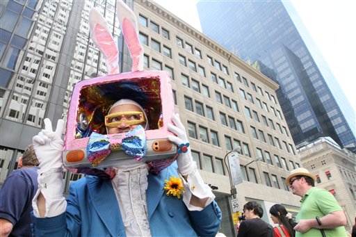 
 Dressed as a rabbit television, Davey Mitchell, of New York, left, poses for photographs as he takes part in the Easter Parade along New York's Fifth Avenue Sunday April 24, 2011. (AP Photo/Tina Fineberg)
 