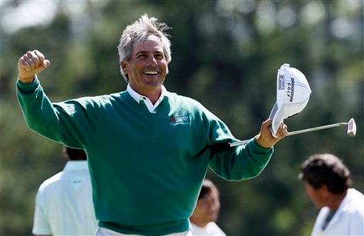 
 Fred Couples celebrates after finishing the second round the Masters golf tournament on the 18th hole Friday, April 6, 2012, in Augusta, Ga. (AP Photo/David J. Phillip)
 